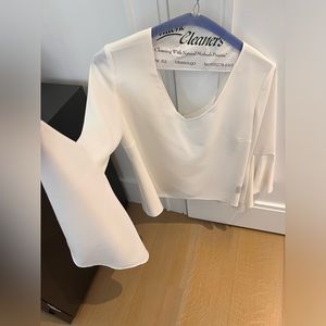 White blouse with dramatic sleeves